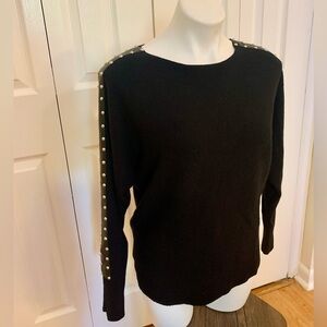 Black sweater with leather and silver stud details
